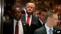 President-elect Donald Trump gets on an elevator after speaking with reporters at Trump Tower in New York, Jan. 9, 2017.