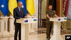 Ukrainian President Volodymyr Zelenskyy, right, and visiting Australian Prime Minister Anthony Albanese take part in a press conference in Kyiv, Ukraine, July 3, 2022.
