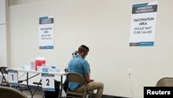 A man receives a dose of the Jynneos monkeypox vaccine as part of DC Health's first vaccination drive in Washington, June 28, 2022.