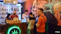 Customers visit the Sensii cannabis dispensary in Bangkok. (Peter Zsombor/VOA)