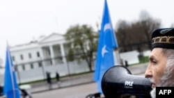 
An activist organized by the East Turkistan National Awakening Movement and the East Turkistan Government in Exile protests the treatment of Uyghurs by the Chinese government outside the White House on April 5, 2022.
