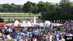 Guests picnic on the South Lawn of the White House during a 4th of July BBQ with military families in Washington, July 4, 2022.