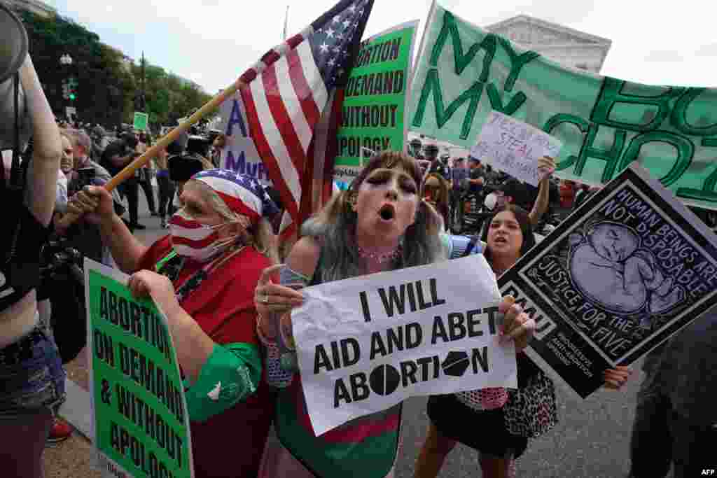 Abortion-rights and anti-abortion demonstrators gather outside the US Supreme Court in Washington. 