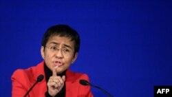 FILE - On May 3, 2022, Nobel Peace Prize laureate Maria Ressa gives a speech at the Cartooning Award Ceremony in Geneva. 