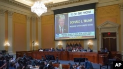 An image of former President Donald Trump during a Fox News phone interview is shown on a screen, as the House select committee investigating the January 6 attack on the U.S. Capitol continues to reveal its findings, June 23, 2022, at the Capitol in Washington. (Pool photo)