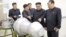 North Korean leader Kim Jong Un provides guidance with Ri Hong Sop (2nd L) and Hong Sung Mu (R) on a nuclear weapons program in this undated photo released by North Korea's Korean Central News Agency (KCNA) in Pyongyang, Sept. 3, 2017. 