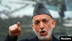 Afghan President Hamid Karzai speaks during a news conference in Kabul, May 4, 2013.