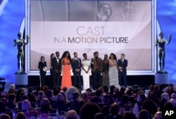 The cast of "Black Panther," accept the award for outstanding performance by a cast in a motion picture at the 25th annual Screen Actors Guild Awards at the Shrine Auditorium & Expo Hall on Sunday, Jan. 27, 2019, in Los Angeles.