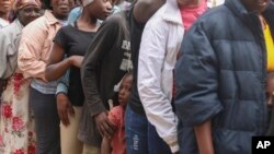 People line up to receive food at a shelter for families displaced by gang violence in the Kenscoff neighborhood of Port-au-Prince, Haiti, Feb. 3, 2025.