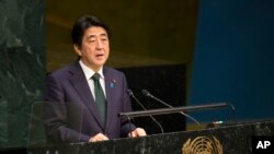 Prime Minister Shinzo Abe, of Japan, addresses the 2015 Sustainable Development Summit, Sunday, Sept. 27, 2015.