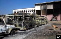 Burnt vehicles by protesters are seen piled up in Rohtak, in Haryana state, India, Feb. 21, 2016.