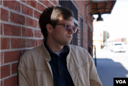 Shaw Drake, an attorney for the ACLU's Border Rights Center in El Paso, talks to VOA across from the El Paso del Norte Bridge between Mexico and the U.S. Drake told VOA the ACLU Border Rights Center launched a program to document abuses at ports of entry. About 25 volunteers have completed training, and are expected to document border officials’ interactions with people arriving at ports of entry. (R. Taylor/VOA)