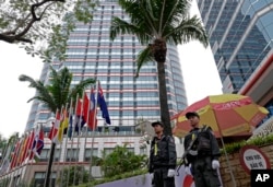 Police officers stand guard in front of the Melia Hotel in Hanoi, Vietnam, Feb. 25, 2019 ahead of the second summit between U.S President Donald Trump and North Korean leader Kim Jong Un.