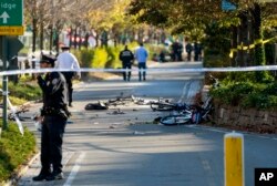 Bicycles and debris lay on a bike path after a motorist drove onto the path near the World Trade Center memorial, striking and killing several people, Oct. 31, 2017, in New York.