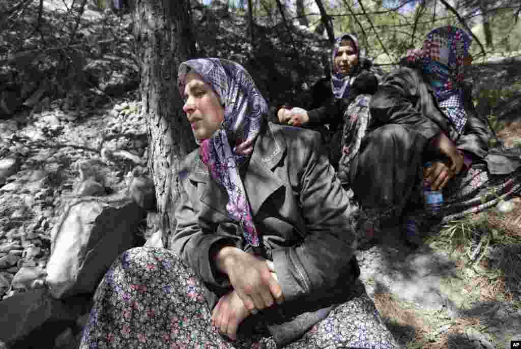 Relatives of the miners wait near the coal mine where disaster struck, Soma, May 15, 2014.