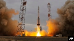 The Proton-M rocket booster blasts off at the Russian leased Baikonur cosmodrome, Kazakhstan, Monday, March 14, 2016. 