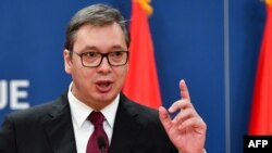FILE - Serbian President Aleksandar Vucic gestures as he speaks during a press conference in Belgrade, Oct. 19, 2019.
