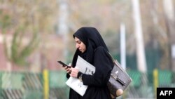 FILE - In this July 7, 2019, photo, Iran's telecommunications minister, Mohammad Javad Azari Jahromi, is interviewed by The Associated Press in Tehran. The U.S. Treasury on Nov. 22, 2019, sanctioned Jahromi over an internet shutdown in Iran.