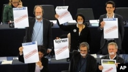Some EU legislators covered their mouth with duct tape and held banners protesting Hungary's controversial media law, as that country's PM Viktor Orban spoke at the European Parliament in Strasbourg, Jan. 19 2011