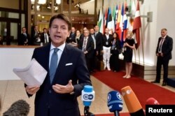 Italian Prime Minister Giuseppe Conte leaves a European Union leaders summit in Brussels, Belgium, June 29, 2018.
