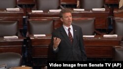 In this image from Senate video, Sen. Rand Paul, R-Ky., and a Republican presidential contender, speaks on the floor of the U.S. Senate Wednesday afternoon, May 20, 2015, at the Capitol in Washington, during a long speech opposing renewal of the Patriot A