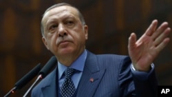 Turkey's President Recep Tayyip Erdogan addresses his supporters at the parliament in Ankara, Turkey, Nov. 28. 2017.