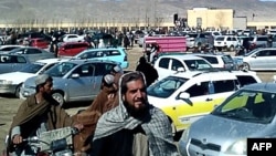 FILE - This screen grab from a video taken on Feb. 22, 2024, shows Afghan men leaving a football stadium after attending the public execution by Taliban authorities of two men convicted of murder, in Ghazni. On Feb. 26, 2024, an execution took place in Sheberghan.