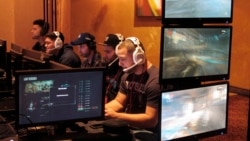 In this March 31, 2017, file photo, video game players compete against one another in an esports tournament at Caesars casino in Atlantic City, N.J. (AP Photo/Wayne Parry, File)