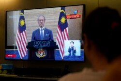 PM Malaysia, Muhyiddin Yassin saat memberikan pengarahan soal penanggulangan pandemi COVID-19 yang disiarkan melalui televisi di Kuala Lumpur, Malaysia, 27 Maret 2020. (Foto: dok)