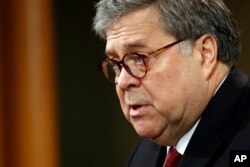 FILE - Attorney General William Barr speaks about the release of a redacted version of special counsel Robert Mueller's report during a news conference, April 18, 2019, at the Department of Justice in Washington.