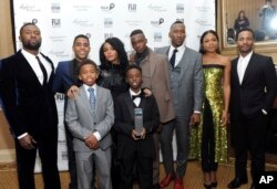 FILE - The cast of "Moonlight," winners of the Jury Award for Ensemble Performance, pose for a photo at the IFP Gotham Independent Film Awards at Cipriani Wall Street in New York, Nov. 28, 2016.