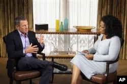 FILE - Talk-show host Oprah Winfrey interviews cyclist Lance Armstrong in Austin, Texas, January 14, 2013.
