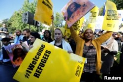 Protesters gather outside the White House for "NoMuslimBanEver" rally against what they say is discriminatory policies that unlawfully target American Muslim and immigrant communities, in Washington, Oct. 18, 2017.
