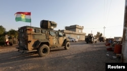FILE - Iraqi and Kurdish fighters take part in an intensive security deployment after Islamic State militants took over a village in Kirkuk the previous day, Dec. 6, 2021. A recent joint operation occurred in the Gharaw Palkana area of Khurmatu district, a known ISIS stronghold.