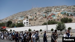 FILE - Afghan peace marchers arrive in Kabul, Afghanistan, June 18, 2018..