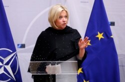 FILE - Then-Dutch Defense Minister Jeanine Hennis-Plasschaert delivers a speech in Brussels, Belgium, Feb. 16, 2017.