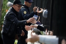 Volunteers distribute food at a makeshift camp in Durres, after an earthquake shook Albania, November 29, 2019.