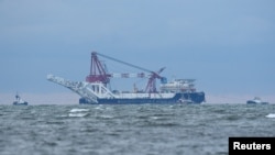 FILE - The Russian pipe-laying ship "Fortuna" is seen in the Mecklenburg Bay ahead of the resumption of Nord Stream 2 gas pipeline construction near Poel island, Germany, Jan. 14, 2021. 