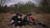 Asylum-seeking unaccompanied minors from Central America are separated from other migrants by U.S. Border Patrol agents after crossing the Rio Grande river into the United States from Mexico, March 14, 2021. 
