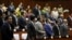 Members of parliament attend a plenary session at the Cambodia National Assembly in Central Phnom Penh, December 16, 2015. 