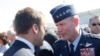FILE - In this June 19, 2017 file photo, French President Emmanuel Macron, meets with Gen. Tod Wolters, while visiting the Paris Air Show in Le Bourget, north of Paris.