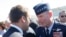 FILE - In this June 19, 2017 file photo, French President Emmanuel Macron, meets with Gen. Tod Wolters, while visiting the Paris Air Show in Le Bourget, north of Paris.
