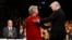 Democratic presidential nominee Hillary Clinton and Republican presidential nominee Donald Trump shake hands during the presidential debate at Hofstra University in Hempstead, N.Y. 