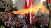 Protesters set a U.S flag on fire near the U.S. Embassy in Awkar north of Beirut, Lebanon, Dec. 10,2017. 