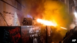 Federal agents use crowd control munitions to disperse Black Lives Matter protesters at the Mark O. Hatfield United States Courthouse on July 19, 2020, in Portland, Ore.
