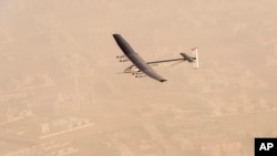 In this photo released by Solar Impulse, "Solar Impulse 2", a solar-powered airplane flies after taking off from Al Bateen Executive Airport in Abu Dhabi, United Arab Emirates, March 9, 2015.
