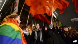 Women march to protest a plan in Poland's parliament to tighten the country's already restrictive abortion law, in Warsaw, Jan. 17, 2017. Similar protests were held in other Polish cities.