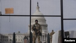 National Guard members stand guard outside the U.S. Capitol ahead of U.S. President-elect Joe Biden's inauguration, in Washington, Jan. 17, 2021. 