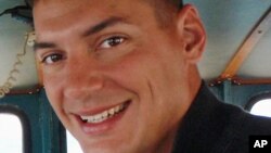 FILE - This undated file photo obtained from the family of Austin Tice shows American freelance journalist Austin Tice, who was 