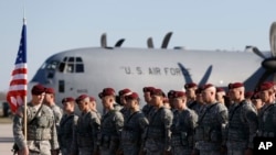 FILE - Members of the U.S. Army 173rd Airborne Brigade attend a welcome ceremony upon their arrival at a Lithuanian air force base in Siauliai, Lithuania, April 26, 2014. Troops from the brigade will be among those participating in exercises Rapid Trident.